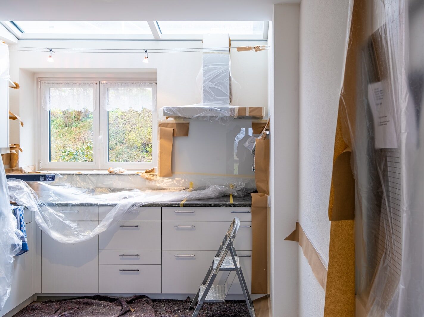 white wooden cabinet near window